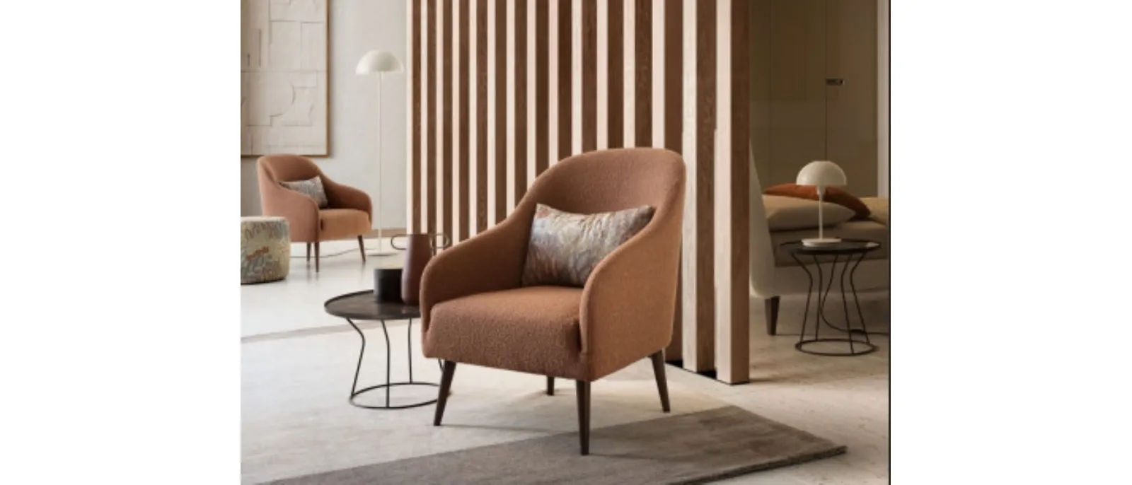 A comfortable chair upholstered in fabric with a modern aesthetic design which