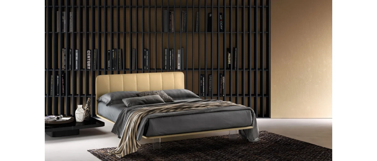 Leather bed with quilted headboard and transparent Clever feet by Bside.