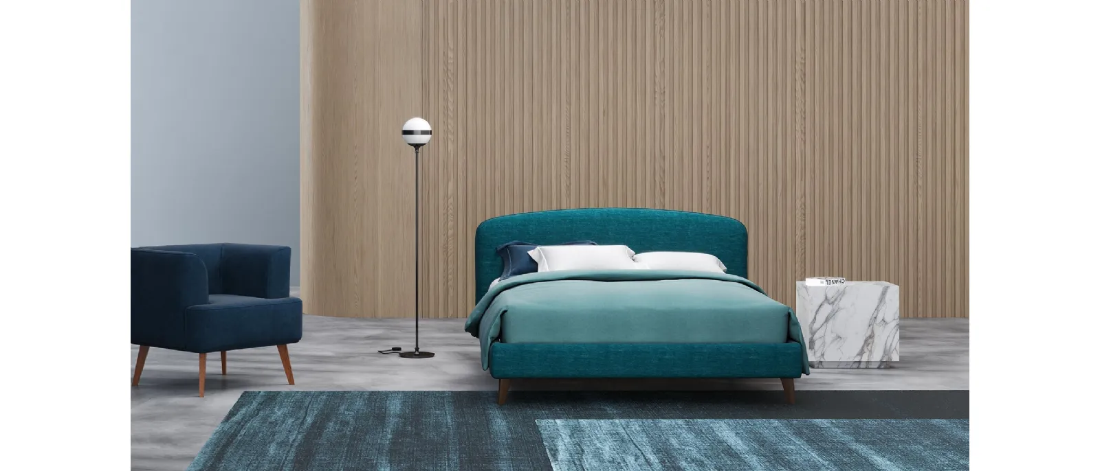 Harry fabric bed from DIVALLETTI Home with rounded headboard. The bed is composed by a base and