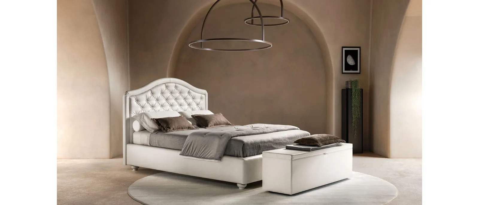 Bed in eco-leather with shaped and quilted headboard Infinity by Bside.