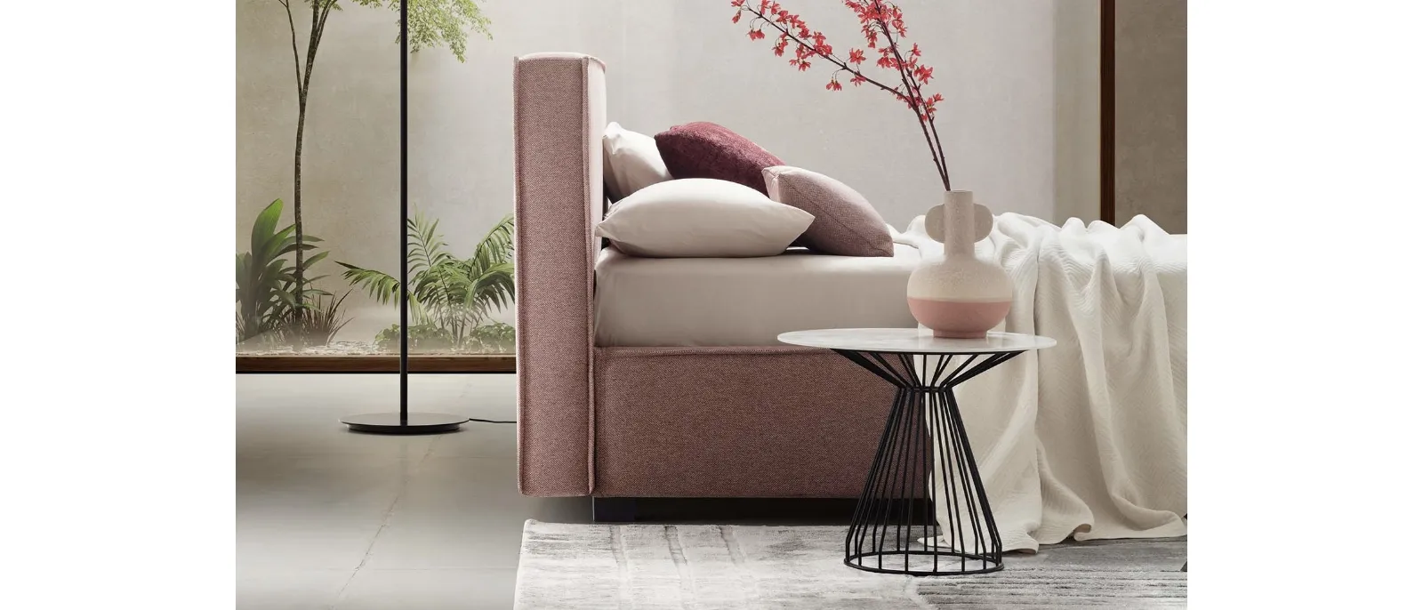 The upholstered bed with headboard Ipanema is designed by Fabio Fossataro for Le
