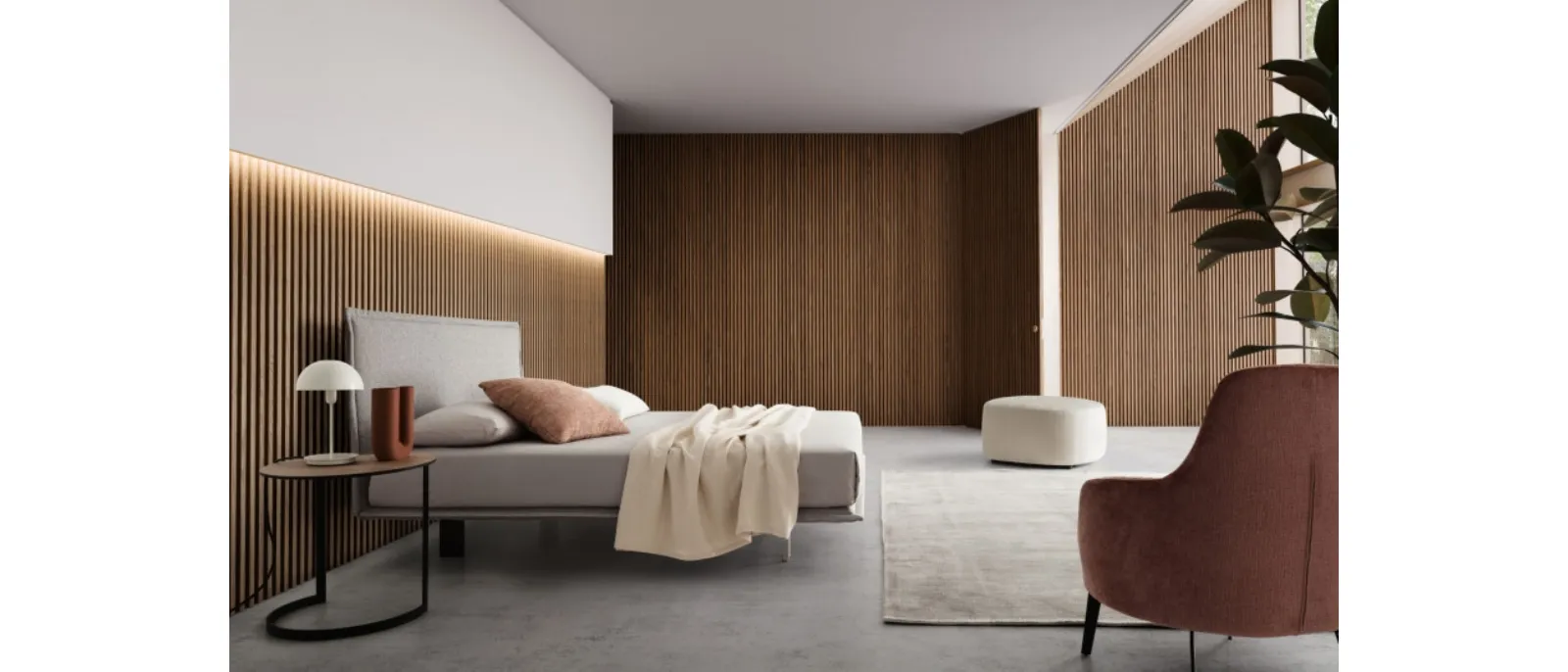 Bed with fabric headboard from Le Comfort company called Vasco
