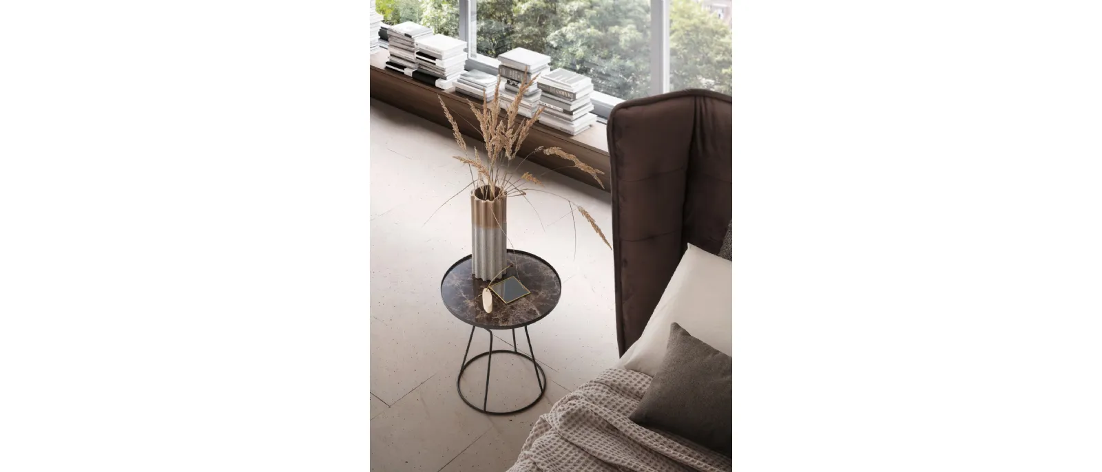 Jago coffee table has a marble finish, and is finished with the same material as the floor of the room where it