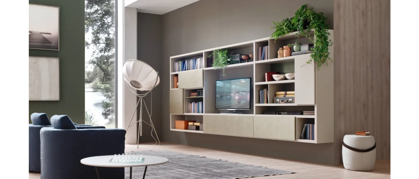 The wall unit is a system composed of shelves and elements of the various collections that can be arranged to suit
