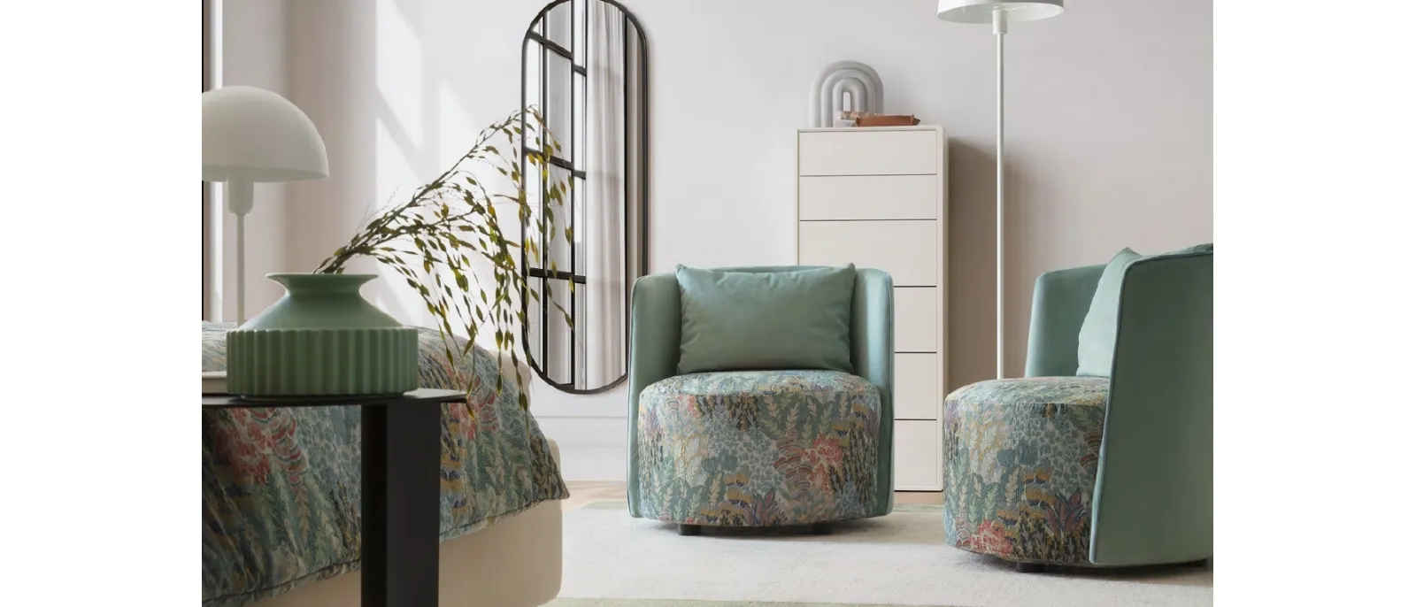 Isabel armchair by Le comfort has a solid wood frame and upholstered in fabric with floral pattern,