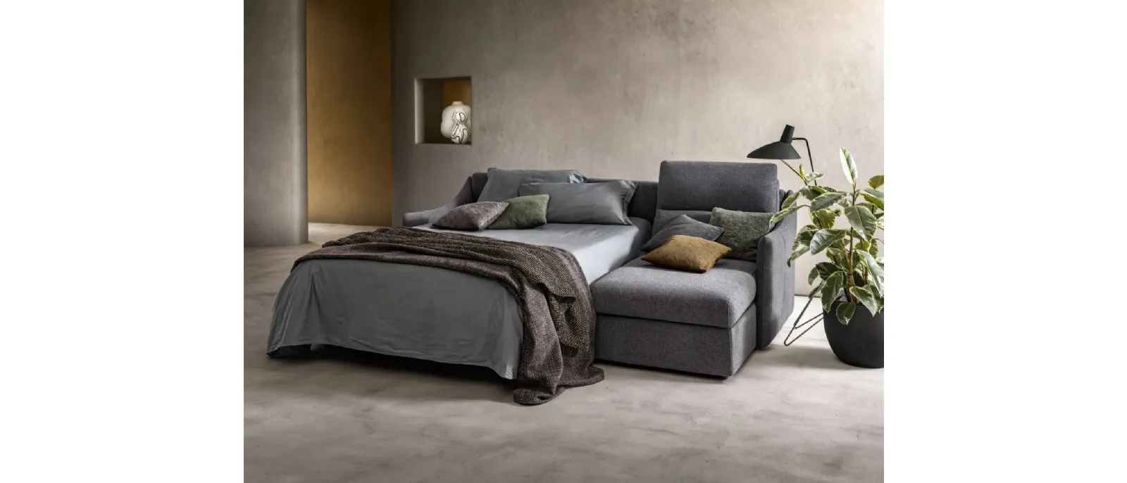 Logan sofa bed with chaise longue by Samoa.