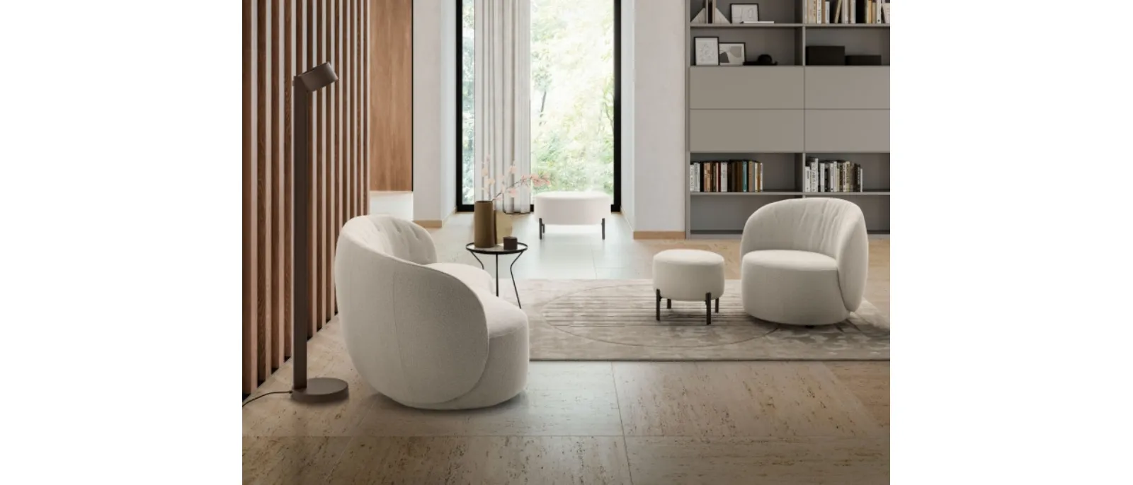 Soft and round shapes made of fabric for the soft and comfortable armchair Moby by Le Comfort. This new design is inspired