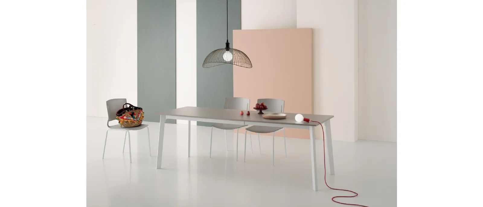 Extendable table Krono with 90-degree angled top in laminate and metal base by Pointhouse.