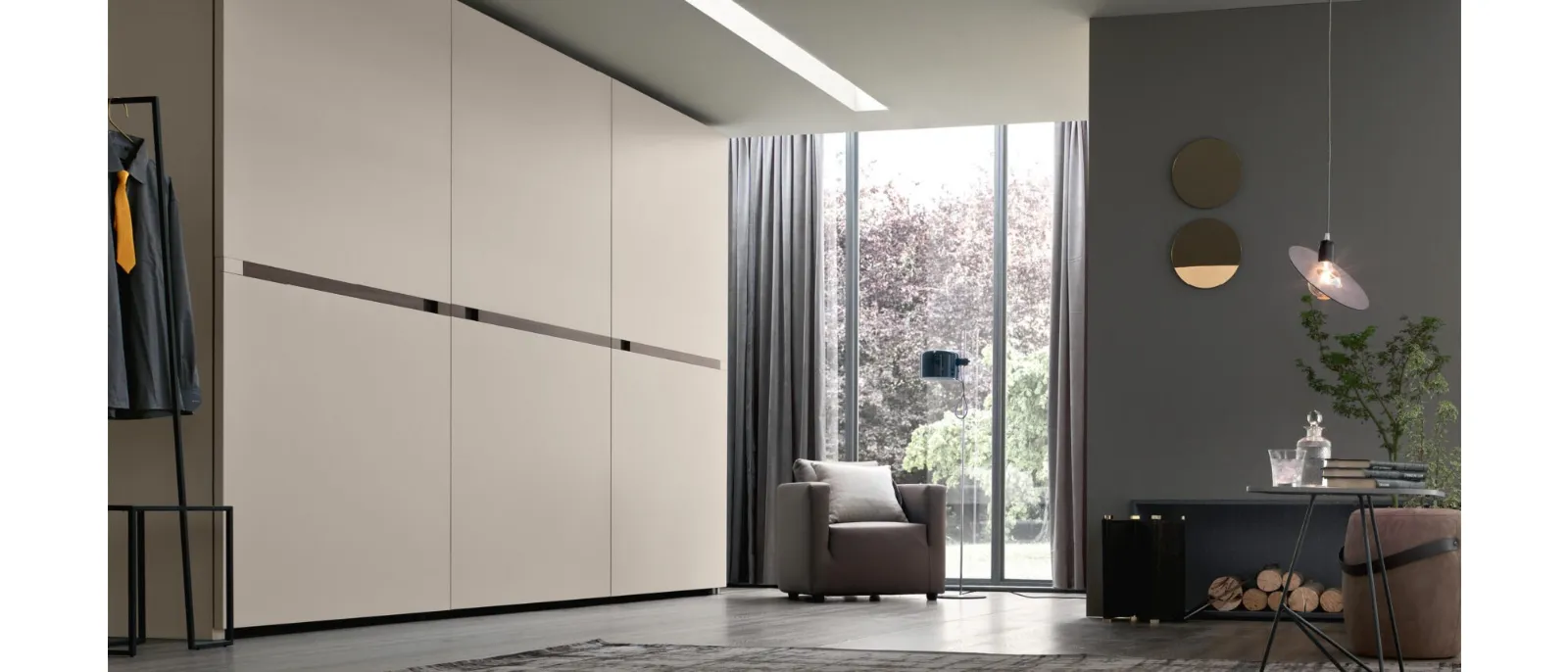 A complete wardrobe with sliding door Ciak of the Italian brand Maronese.