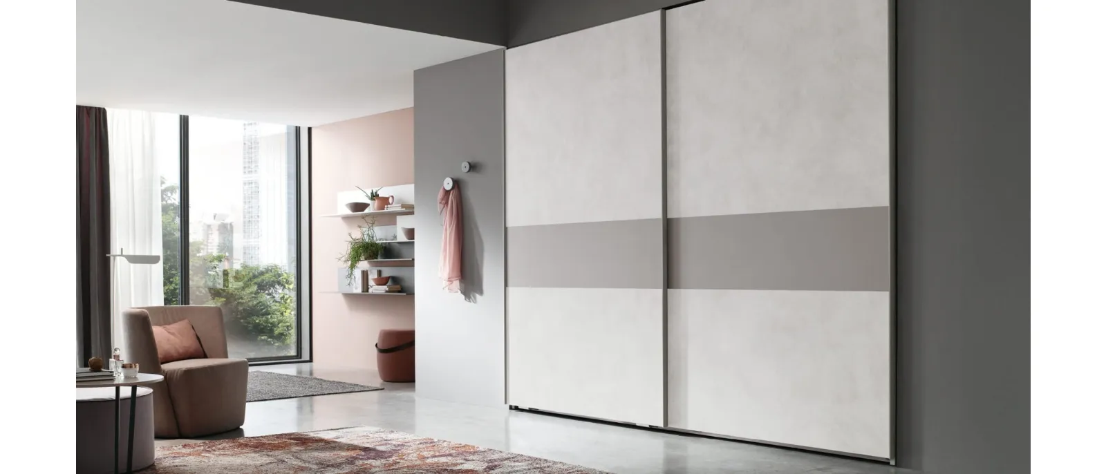Next is a wardrobe system with sliding doors by Maronese that combines the elegance