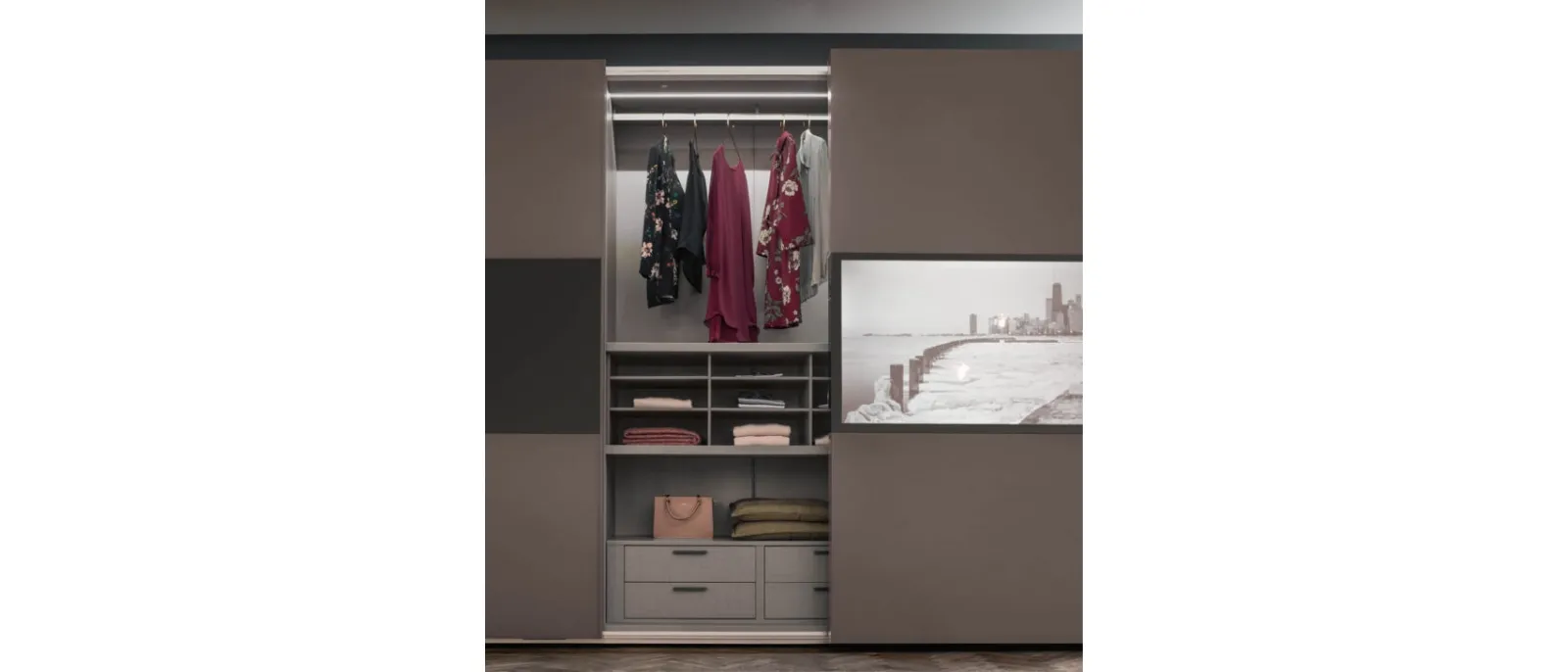 TV wardrobe with a central section for the television and storage space
