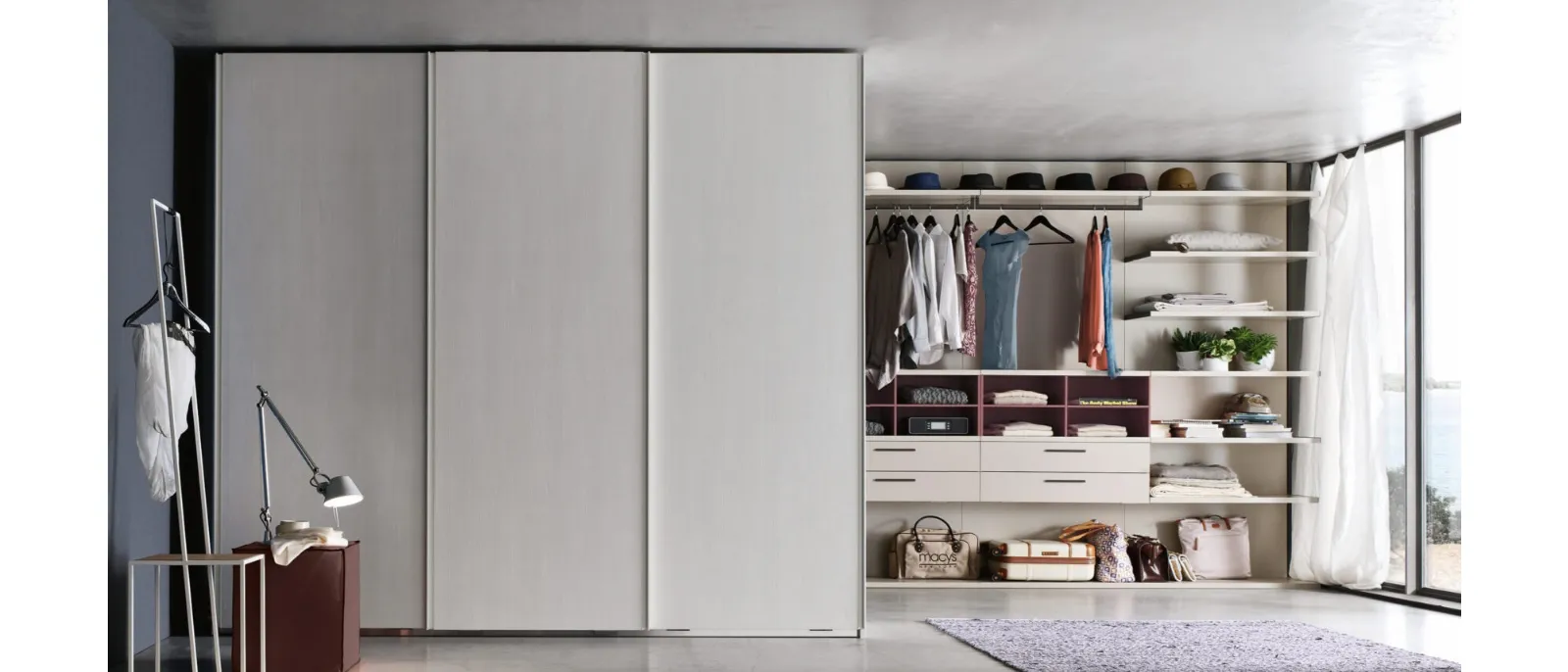 The step is a sliding door wardrobe designed by Gianluca Pel