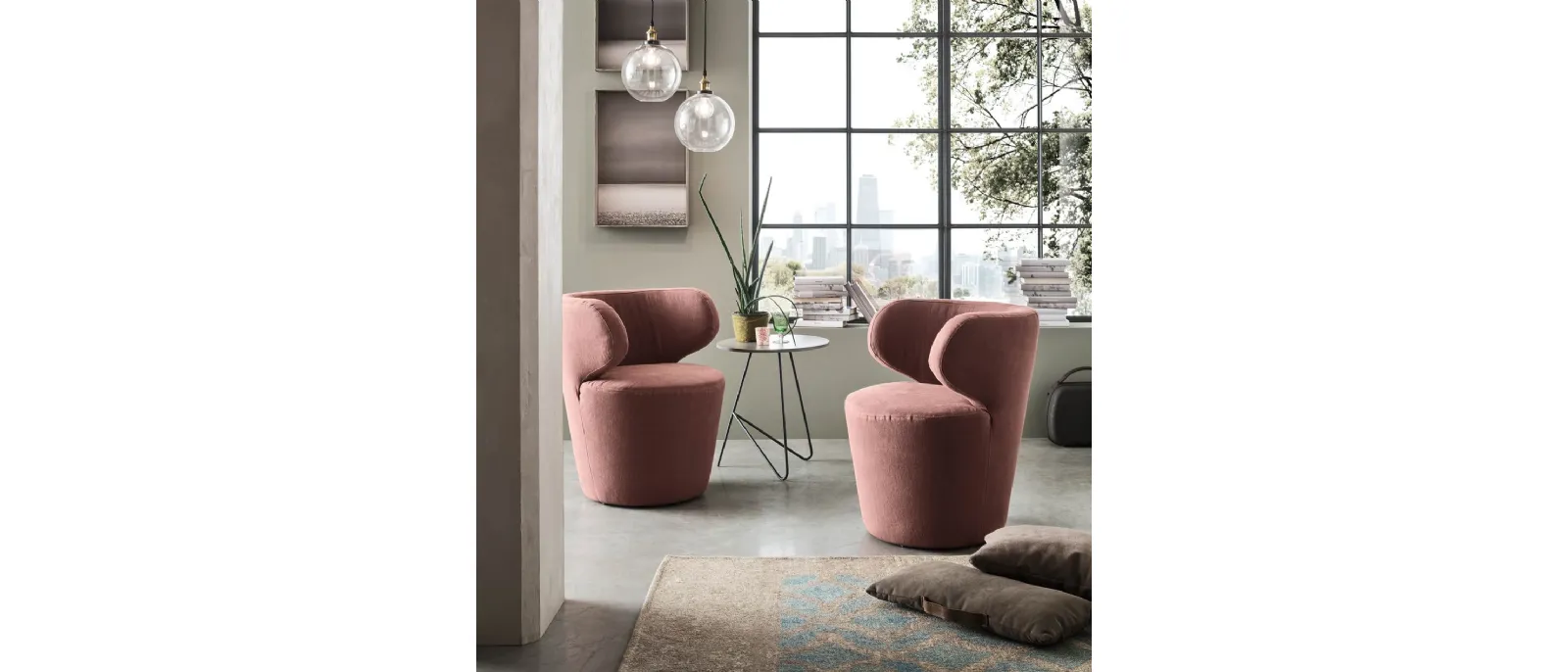Zalea is a small chair with low arm